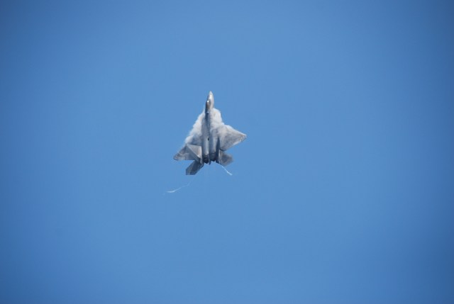 F-22 standing on its tail. That plane weighs WAY over 10 tons.  