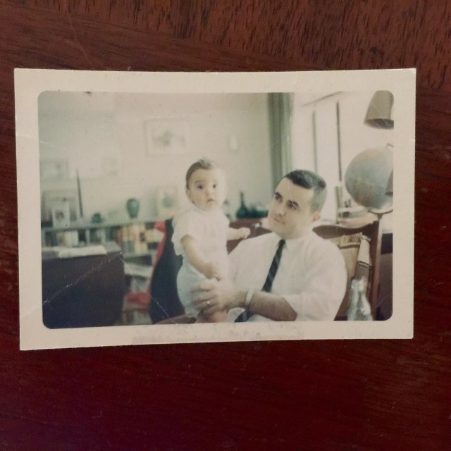 My late father holding me in 1962. Picture taken by his father.