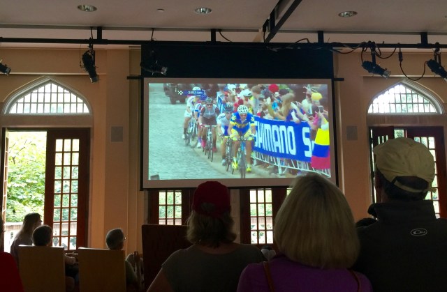 Picture of a TV picture of the cyclists climbing the cobblestones on Libby Hill for the first time today. 